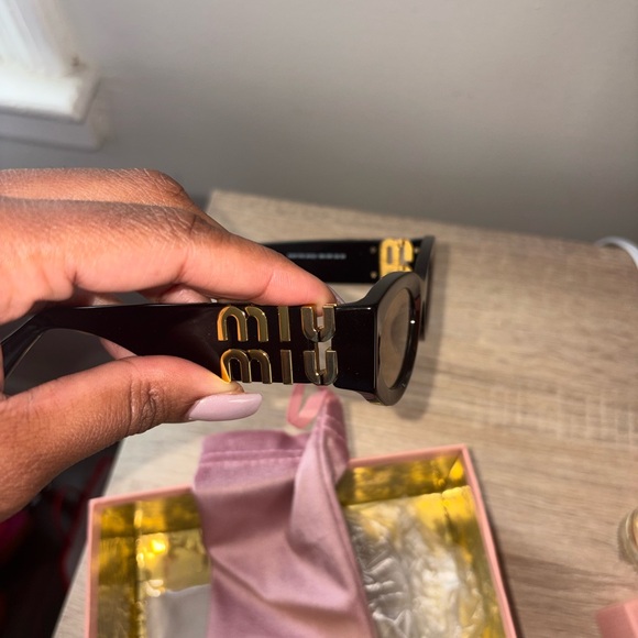 Miu Miu Black Sunglasses with Gold Detailing main image 6